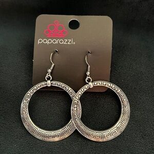 Fish hook earring. Silver/textured design.
